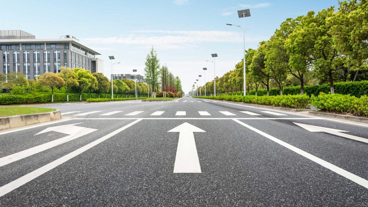 Arrows directions on asphalt road